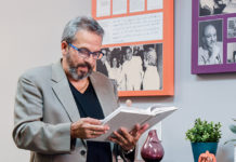 What is Your Body Language Saying? Albizu University professor reading a psychology book