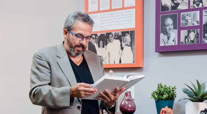 What is Your Body Language Saying? Albizu University professor reading a psychology book