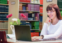 The Different Sides of Psychology Albizu University psychology student using a computer in the library